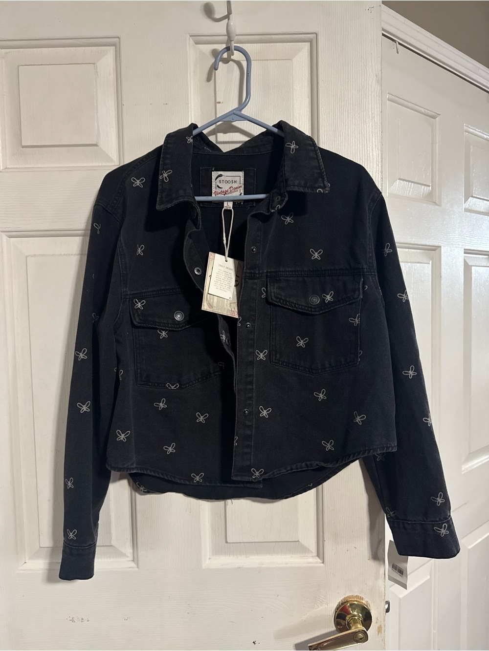 Stoosh Black Jacket with White Label and Red Script